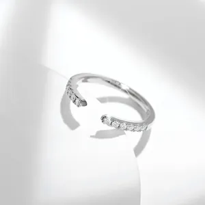 Macro view of S925 sterling silver Moissanite open ring with sparkling pavé stones