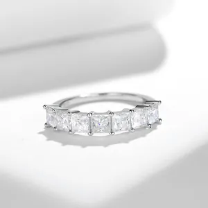 Detailed close-up of elegant S925 silver eternity ring with princess cut moissanite stones