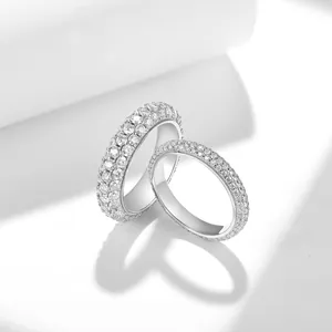 Close-up of full pave moissanite eternity rings in S925 sterling silver for couples.