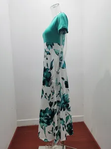 Side view detail of an elegant floral print patchwork maxi dress on a mannequin