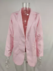 Elegant pink women's blazer featuring lapel collar and front pockets for office wear
