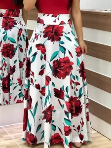Detailed view of high-waisted maxi skirt with bold red floral print on white background