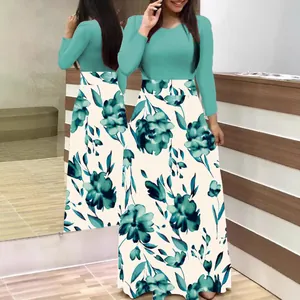 Elegant long sleeve floral maxi dress featuring teal bodice and flower print skirt