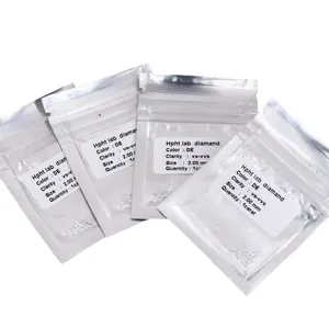 Multiple silver bags containing 2.0mm round cut HPHT lab grown diamonds loose stones