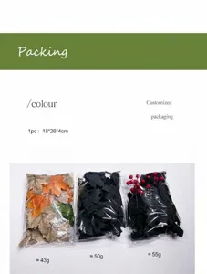 Detailansicht der Verpackung von künstlichen Ahornblättern und Beeren mit Gewichtsangaben.
