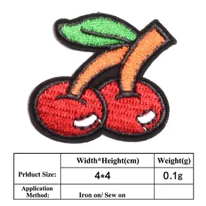 Detailed view of cherry embroidered patch with iron-on and sew-on instructions
