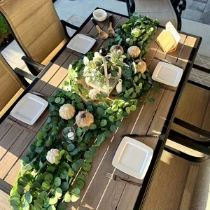 Macro view of lush artificial eucalyptus garland for elegant outdoor table decoration