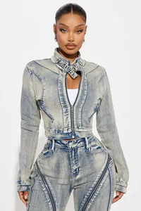 Detailed close-up view of high-stretch acid-wash denim jacket featuring zipper accents