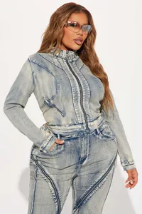 Close-up of stylish light washed denim jacket set with zipper details on a model