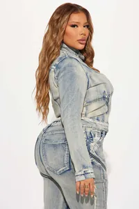 Detailed view of women's washed denim jacket set with zipper accents and sleek fit