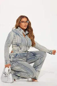 Fashionable high-elasticity washed denim jacket and pants set shown in detail view.