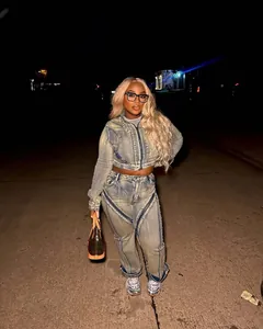 Fashionable street style denim set featuring cropped zip jacket and wide-leg pants