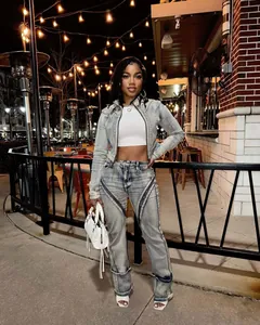 Full view of a trendy washed denim set featuring a cropped jacket and high-waist jeans