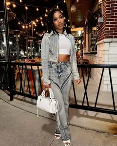 Modern high-stretch washed denim jacket and jeans set with unique zipper details