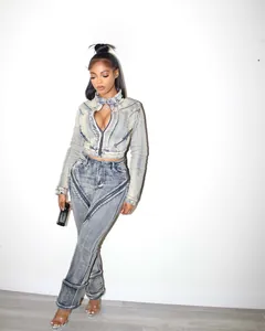 Fashionable washed blue denim jacket and pants set with stylish zipper details