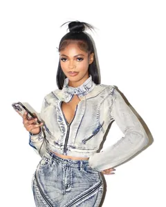 Close-up of acid-wash denim jacket with unique collar cutout and zipper details