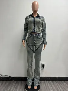 Women's vintage washed denim set featuring a cropped jacket and zipper detailed pants