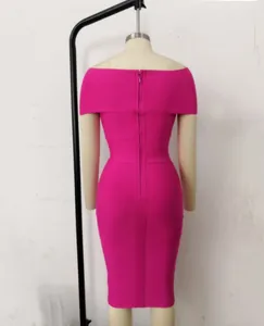Detailed back view of a hot pink off-the-shoulder bandage evening dress on mannequin