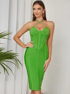 Detail showing the elegant cross-halter neckline and ribbed texture of this green midi dress