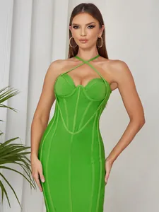 Elegant green cross halter neck bodycon dress with structured corset-style bodice.