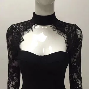 Close-up detail of black lace halter neck dress with delicate floral eyelash trim