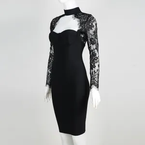 Side profile of a elegant black lace bandage dress with long sleeves on a mannequin.