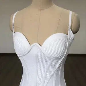 Detailed view of a white ribbed corset dress showing texture and underwire support