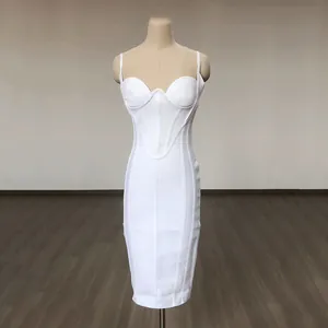 Detailed view of a white bodycon bandage dress with ribbed texture and sweetheart neck.