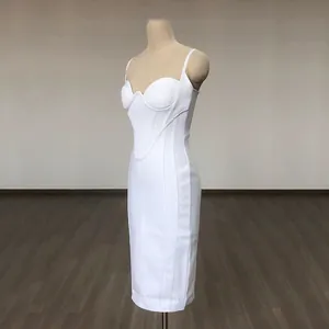 Detailed side view of a white bodycon bandage midi dress with corset bodice on mannequin