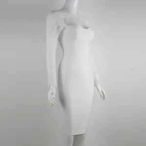 Detail view of an elegant white bandage dress featuring delicate long lace sleeves