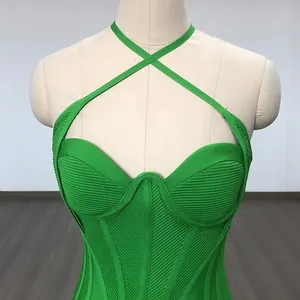 Sexy green bodycon bandage dress featuring a halter cross neck and corset style bodice
