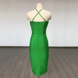 Back view of a green bodycon midi dress featuring elegant cross straps and a zipper.
