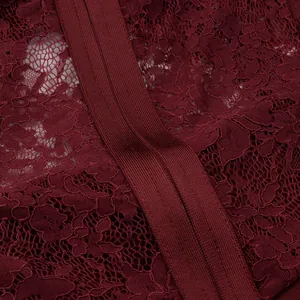 Macro detail of wine red lace pattern and elastic bandage texture of banquet dress