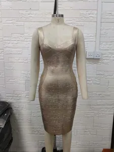 Close-up detail of a gold metallic bandage dress on mannequin with sweetheart neckline