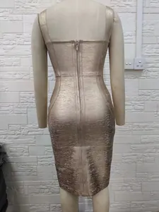 Back view detail of a metallic gold sleeveless bandage dress with zipper closure