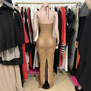 Elegant nude mesh evening gown with sparkling rhinestones and an open back design.