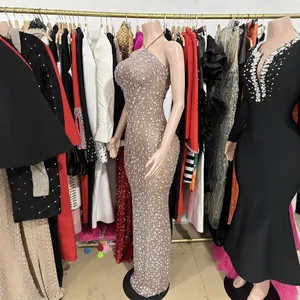 Glamorous champagne mesh floor-length evening gown with heavy silver rhinestone decor