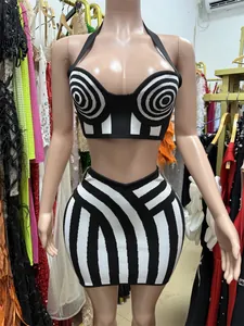 Detail view of a sexy black and white striped knit halter neck top and mini skirt outfit set