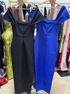 Detail view of the back zipper on slim fit bodycon midi dresses in black and royal blue