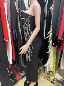 Elegant black bodycon bandage dress with shimmering silver rhinestone tassel details