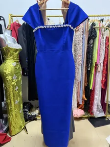 Elegant royal blue slim fit maxi dress featuring silver rhinestone detailing at the neckline