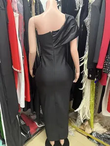 Back view of a sleek black one-shoulder bodycon bandage maxi dress for evening party