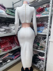 Rear view of an elegant white two-piece set with long sleeve crop top and bodycon maxi skirt