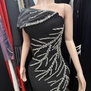 Elegant black one-shoulder bandage dress with pearl and rhinestone leaf patterns.