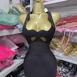 Sexy black halter neck mini dress with diamond cut-out details and low-cut neckline