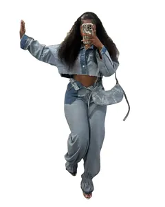 Detail view of color-block denim set featuring cropped jacket and ruched pants
