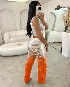 Back view of two-piece set featuring ombre shredded fringe pants and crop top