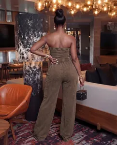 Back view of a casual washed brown tube top jumpsuit with wide-leg pants in a lounge setting.