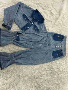 Casual two-piece color block denim jacket and pants set for women in a flat lay