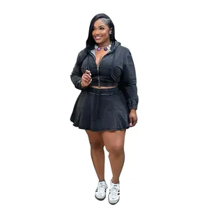 Two-piece washed black denim outfit set with hooded zip jacket and pleated mini skirt.